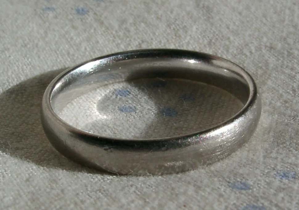 A white-gold wedding band with rhodium plating.