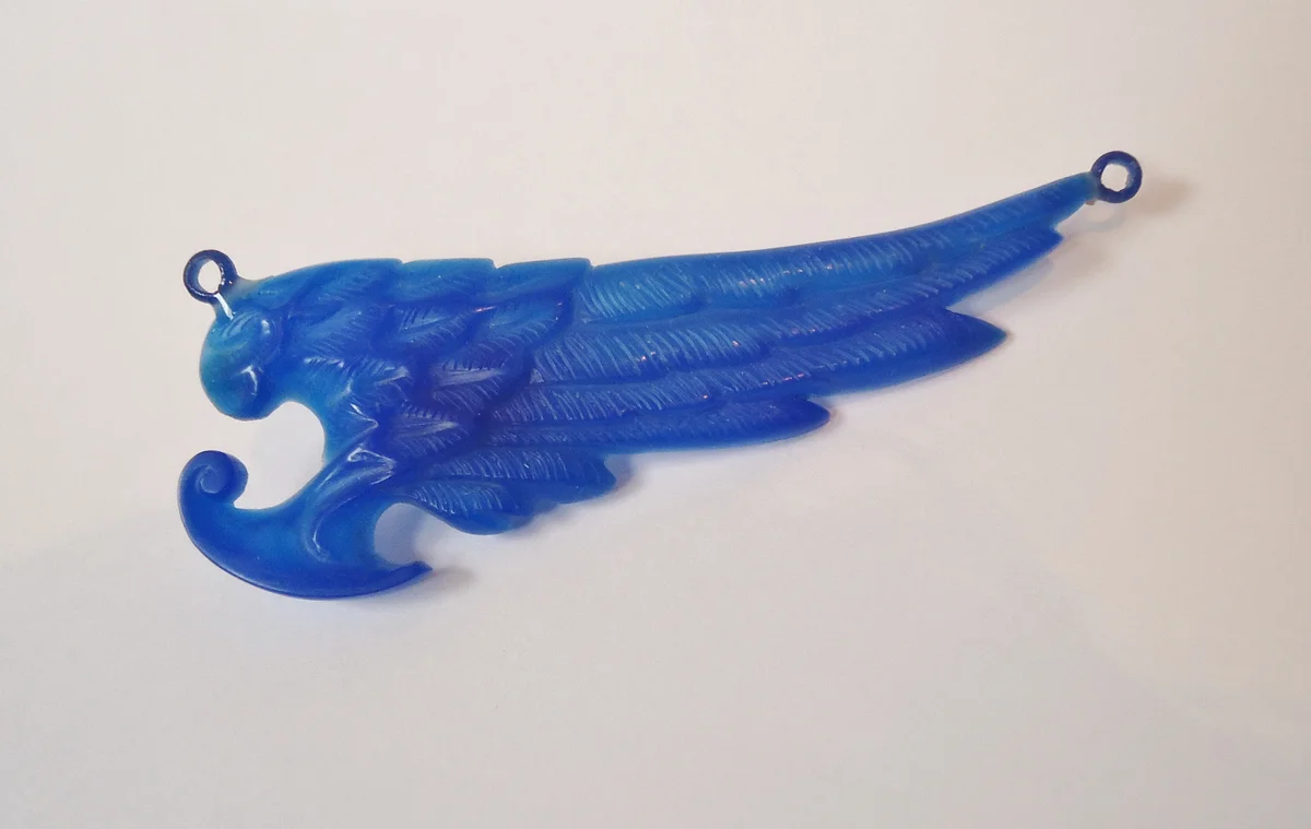 Blue hand-carved wax jewellery model before metal casting.