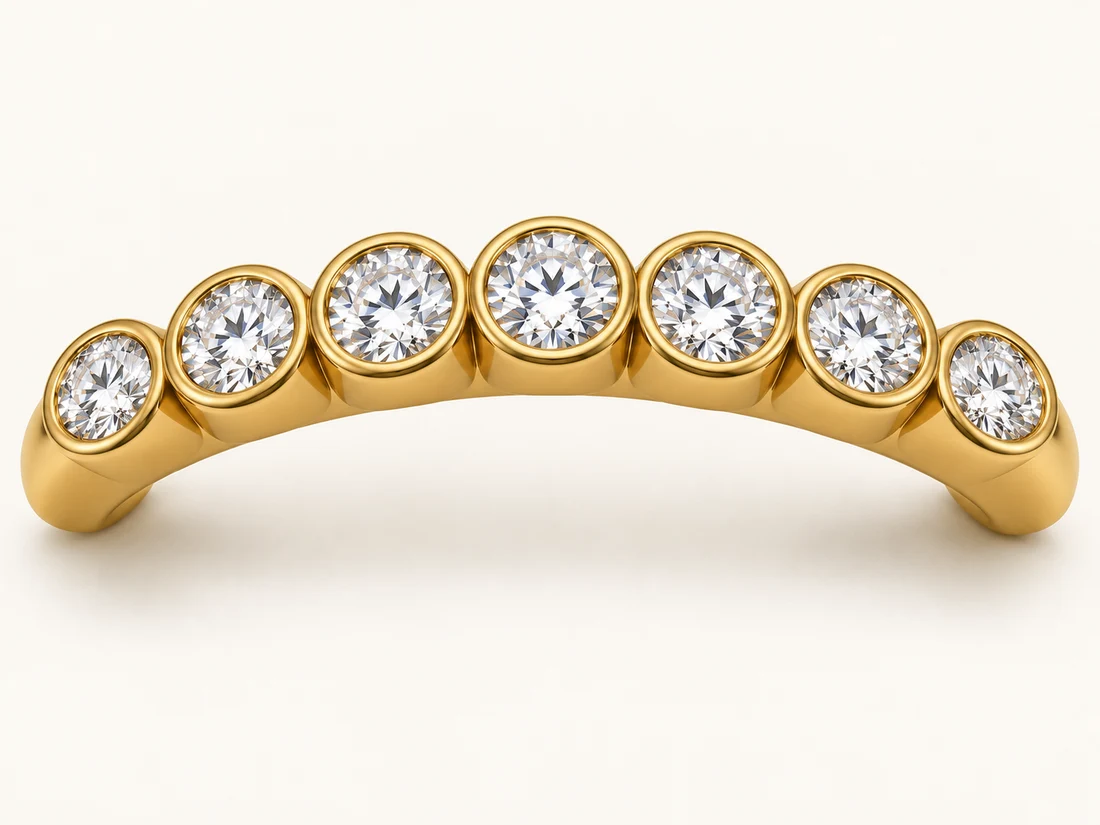Illustration of round diamonds each surrounded by a continuous gold bezel rim.